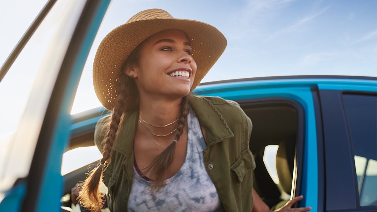 2018 Prius Woman exiting vehicle wearing a hat