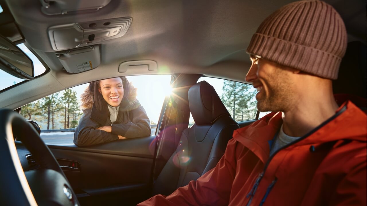 2019 Prius couple in winter clothing talking