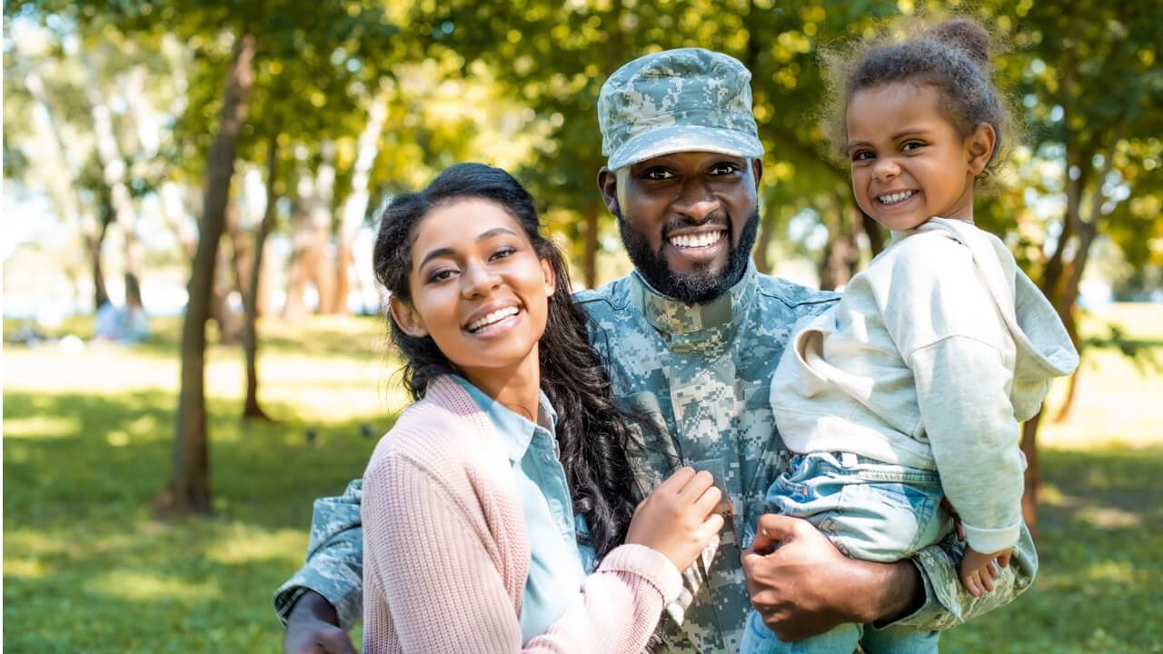 Soldier with wife and daughter