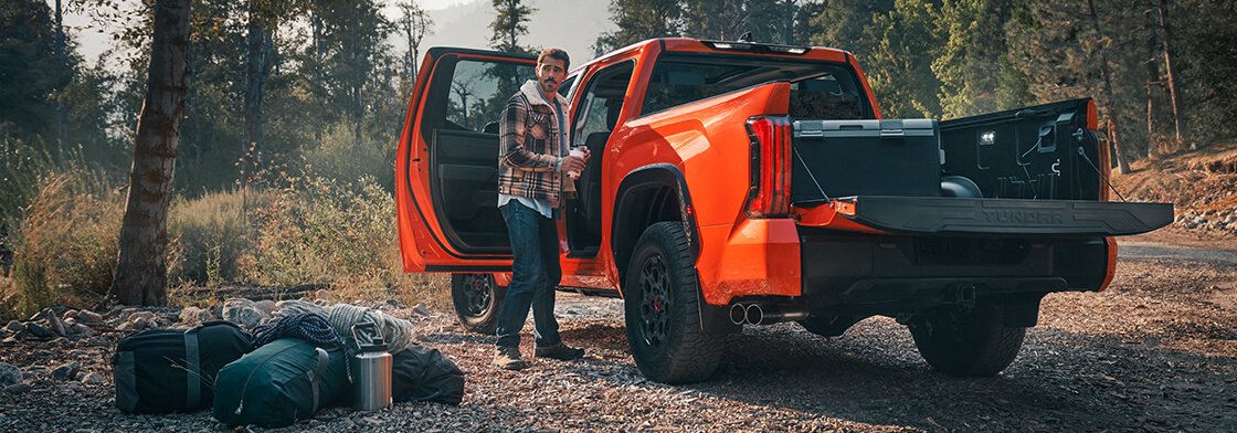 Man camping  with his 2022 Toyota Tundra