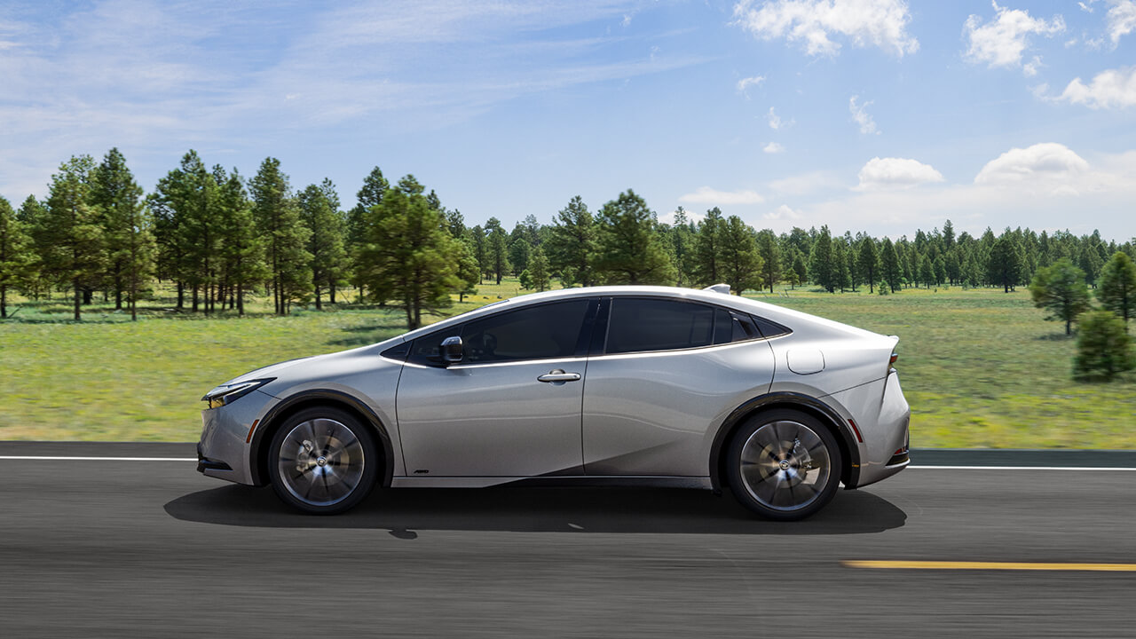 Silver 2024 Prius driving in the countryside