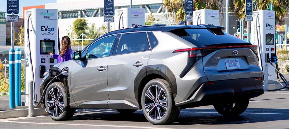 Woman charging her Toyota