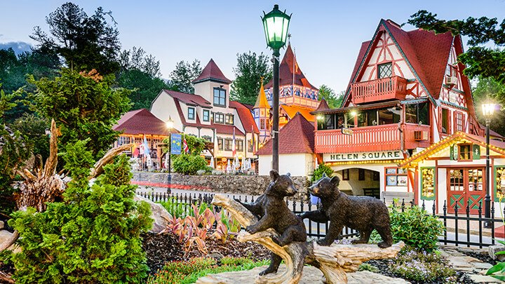 A photo of Helen, Georgia, where the buildings are German-styled with sharp peaks and red colors. 