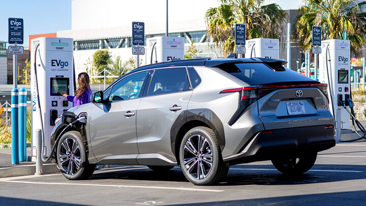 Woman charging her Toyota